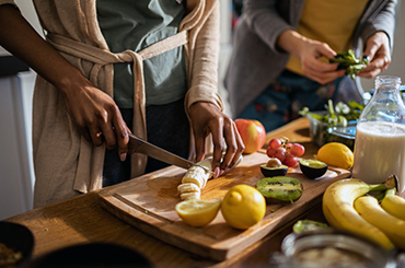 someone slicing healthy food