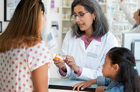 pharmacist giving instruction to the customer