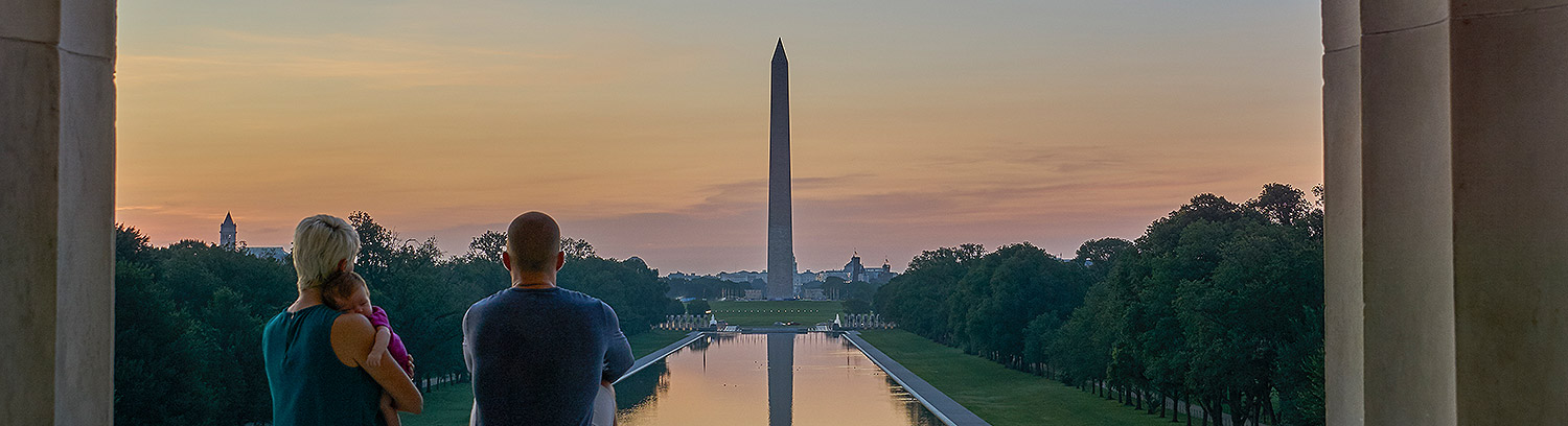 Photo of young family at the Capital, the Washington Monument