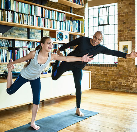 2 people excersicing father daughter excercising
