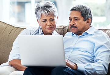 Couple looking at laptop