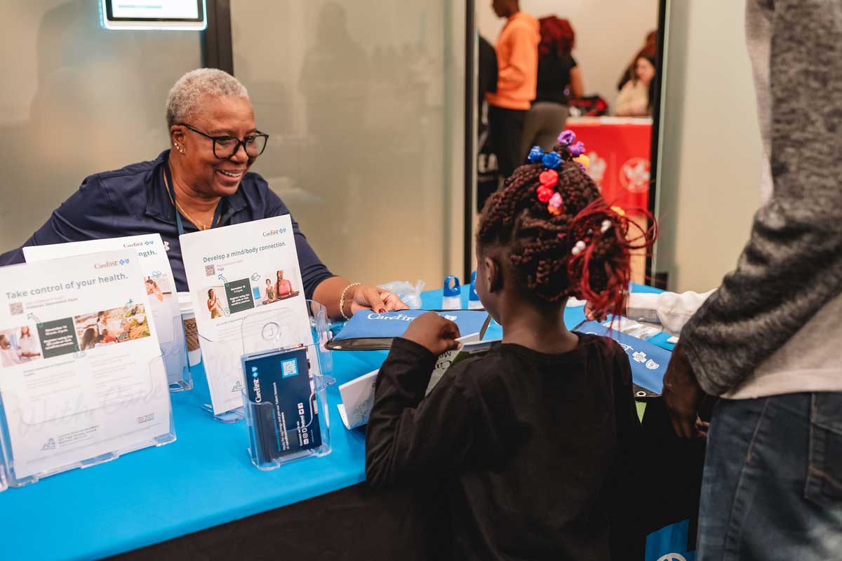 Glenda and child at Community Resource Fair