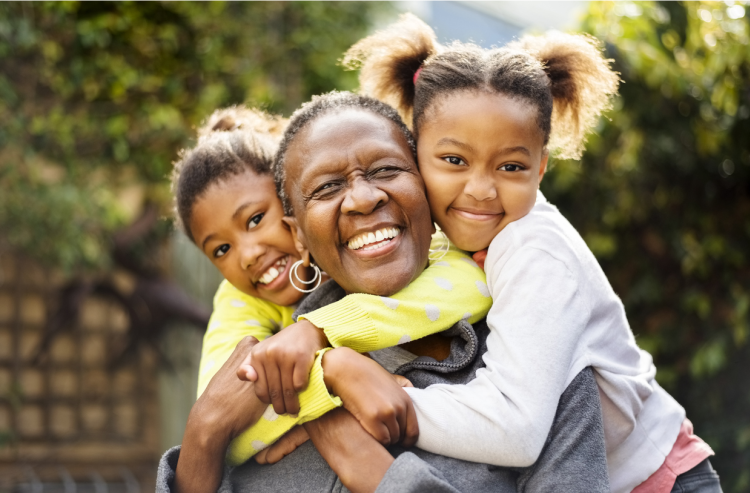 Happy smiling lady in a wheelchair enjoying the outdoors