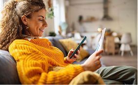 Member using a mobile device in a home setting to access health plan information
