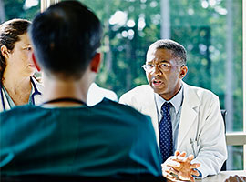 Doctors with patient