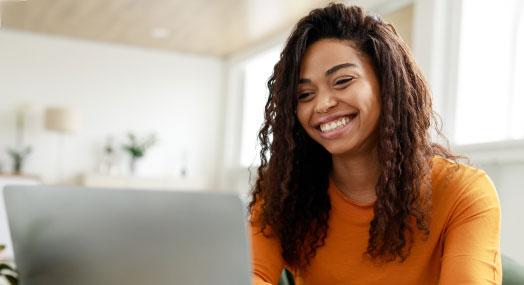 Smiling lady at a laptop