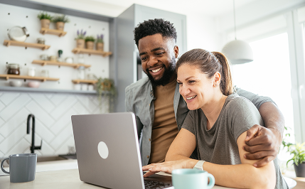 Lifestyle couple using laptop