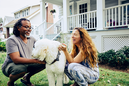 A welcoming pet-friendly neighborhood with homes, greenery and outdoor space, creating a pleasant community setting