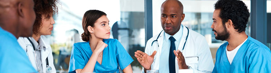 Group of doctors talking at a table.