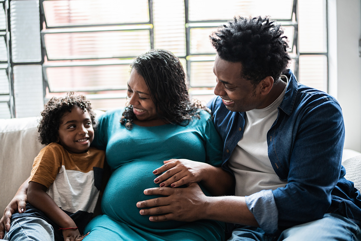 family at home with pregnant woman