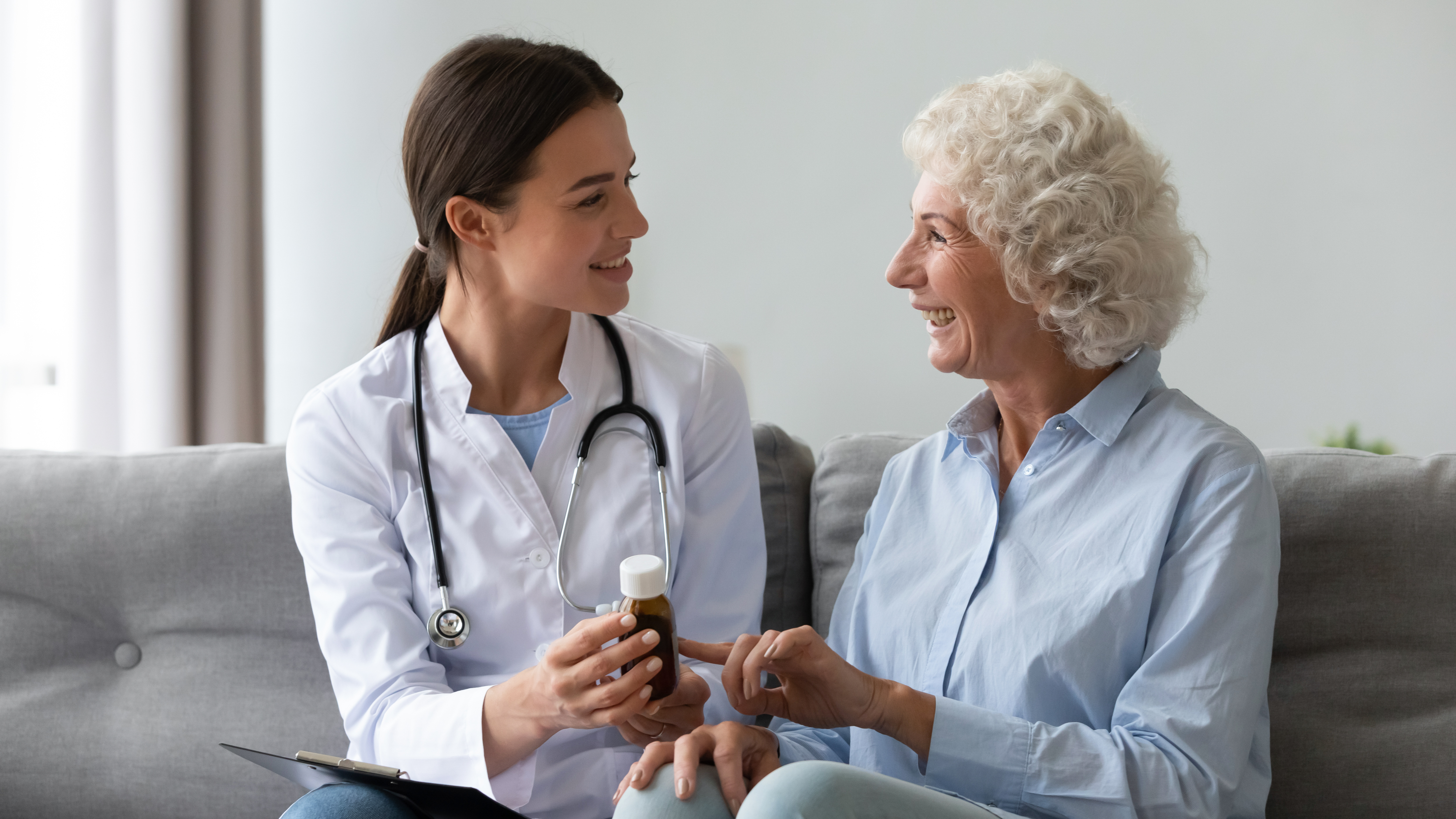 A pharmacist helping an older adult