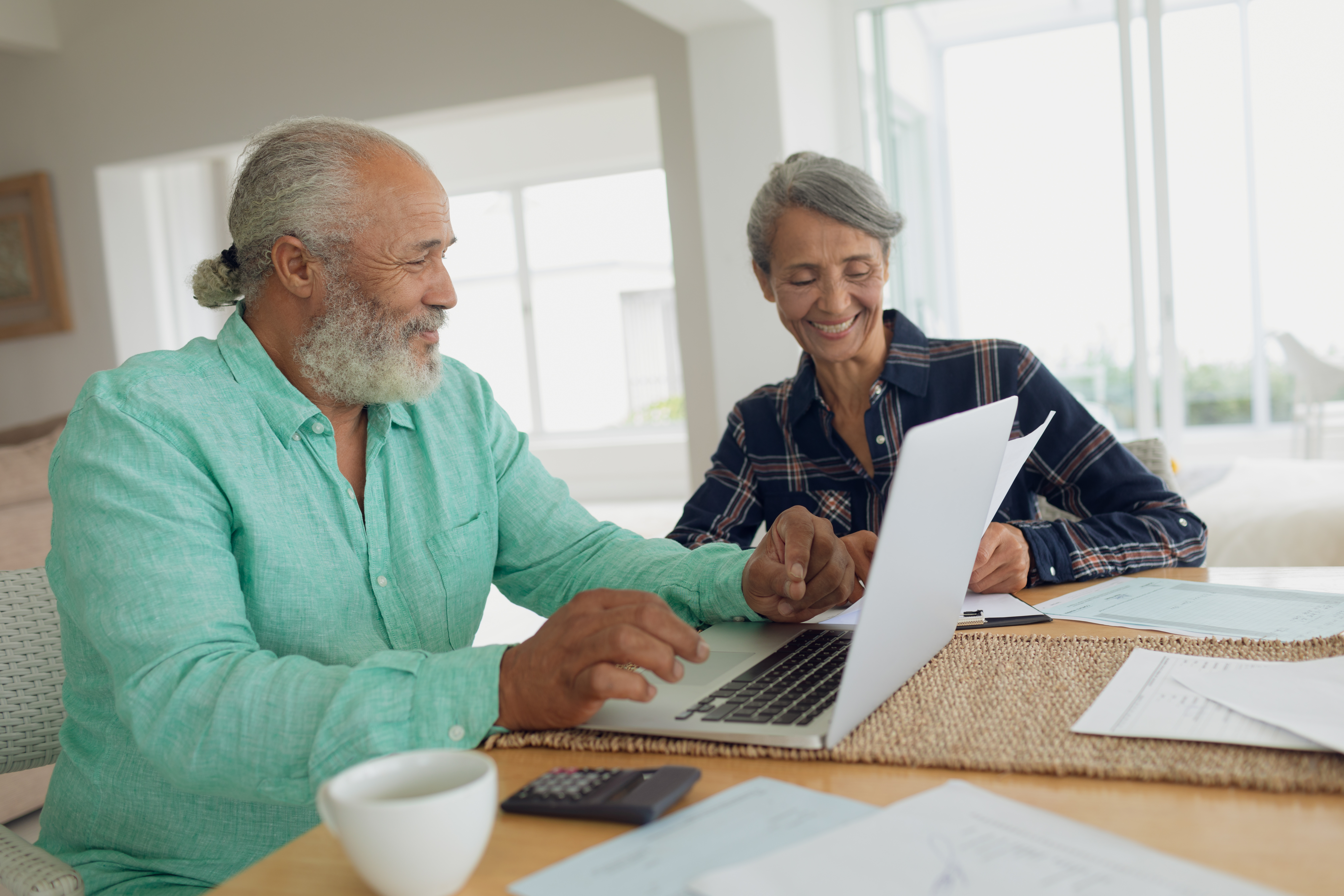 elderly couple reviewing documents