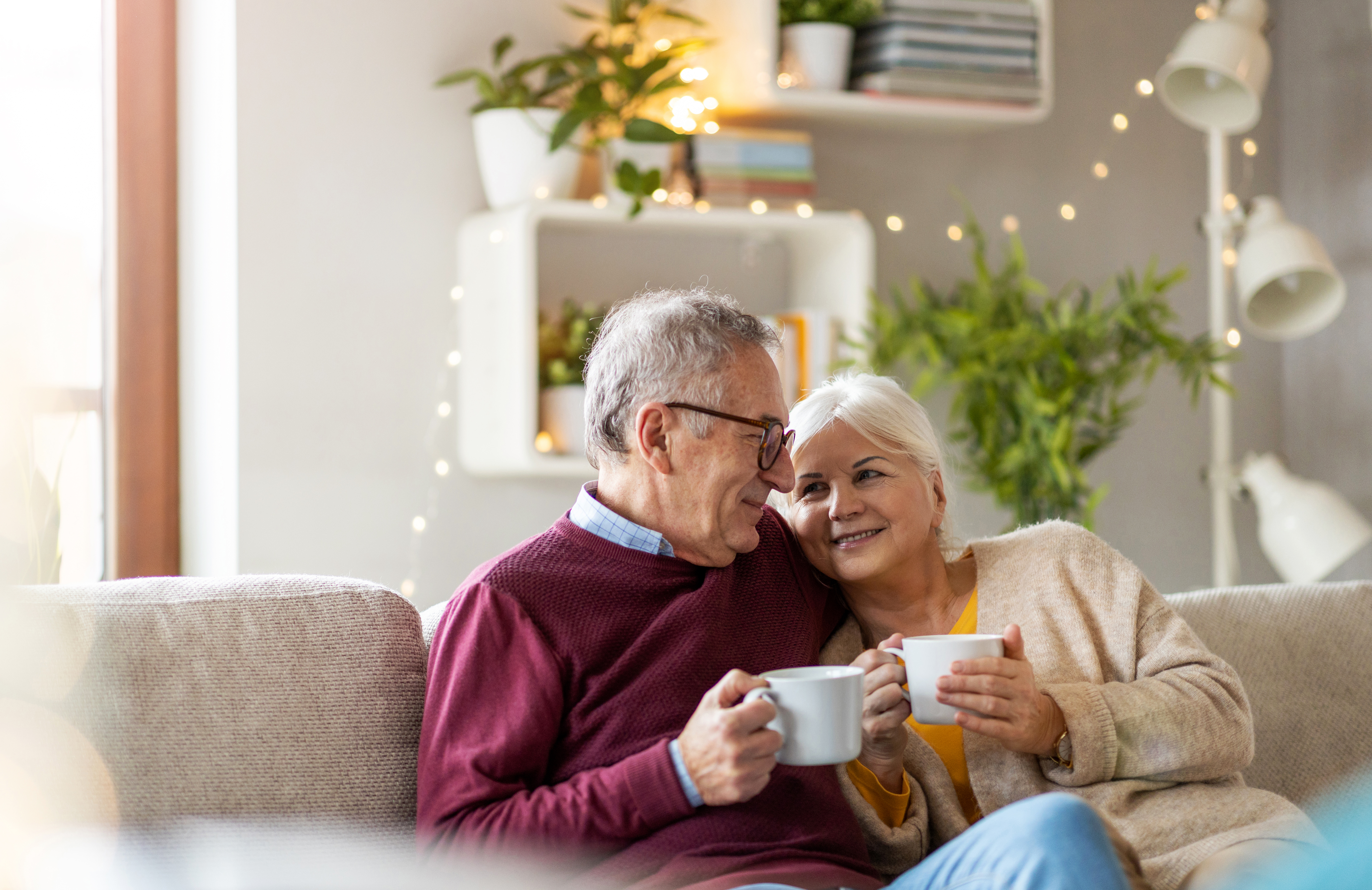 Couple enjoying coffee outdoors in a park setting