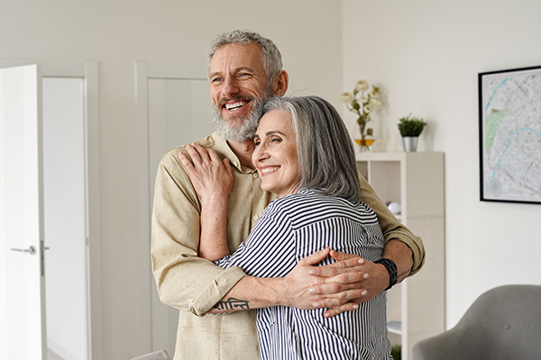 elderly couple cuddling