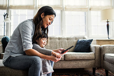 mom managing her finances on phone